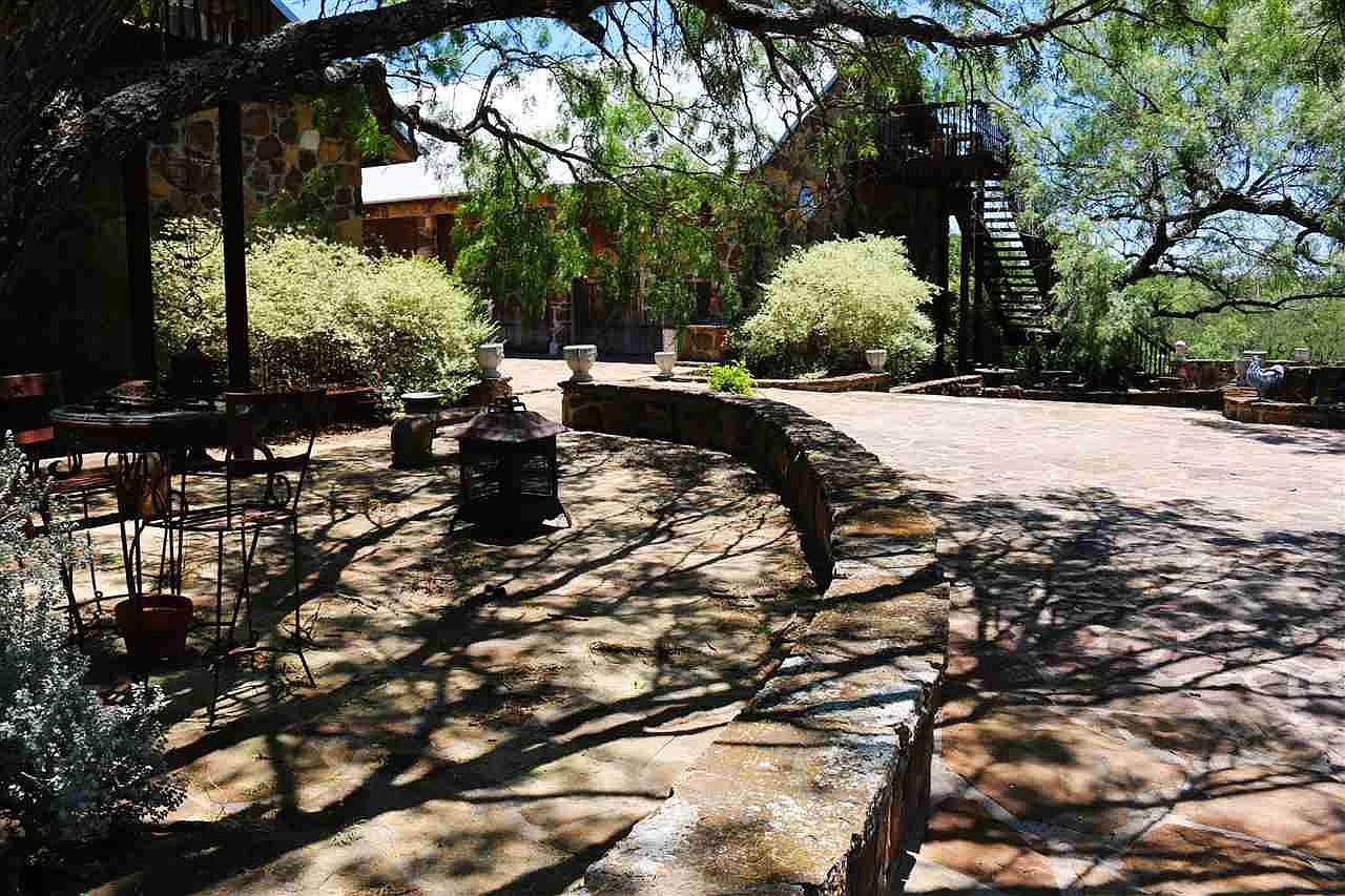 Stone courtyard under the oaks
