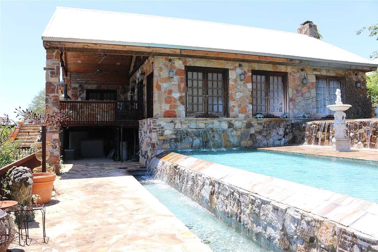 Existing pool and stone pool house
